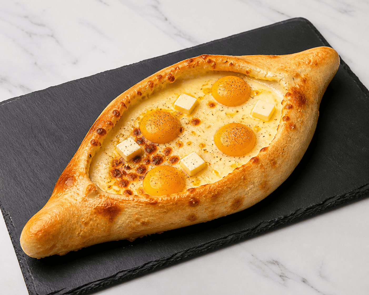 Khachapuri fresh from the oven — molten cheese and egg in a golden boat